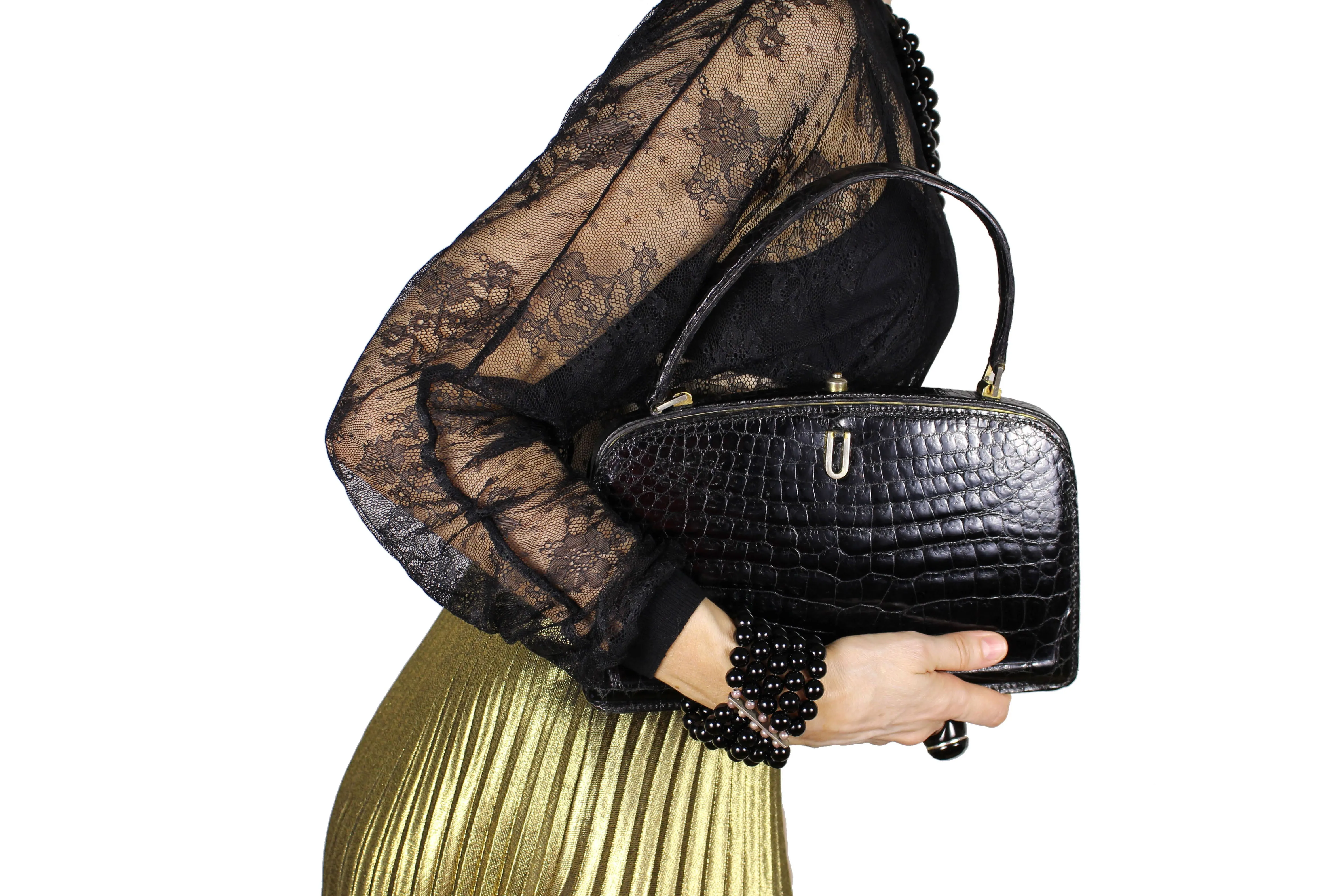 Small black crocodile skin handbag with skin lined frame